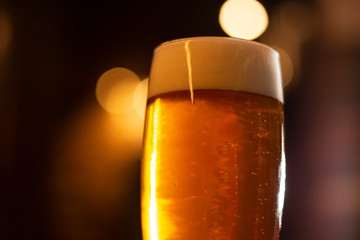 glass of beer with foam