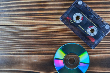Old tape and disk recording on a wooden table