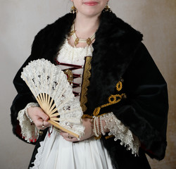 Lady in ancient dress with veil in hand