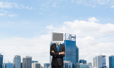 Businessman with monitor instead of head.