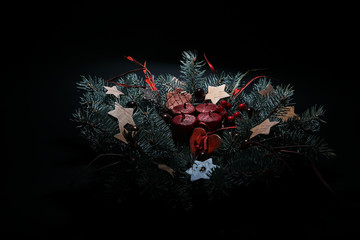 Christmas wreath in the dark in the background