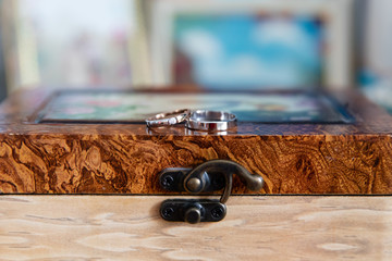 Gold wedding rings on the stand for rings