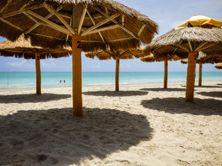 Straw beach umbrellas at a bar in Pilar beach - Ilha de Itamaraca (Pernambuco state, Brazil)