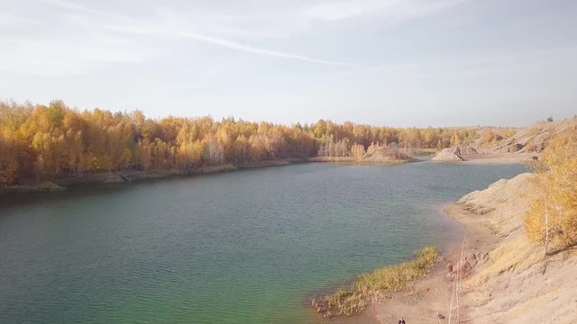 A futuristic autumn lake on another planet. Aerial video footage.
