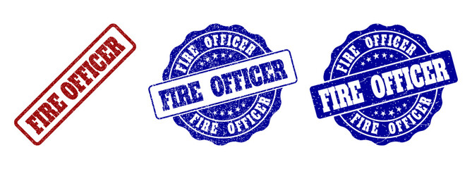 FIRE OFFICER grunge stamp seals in red and blue colors. Vector FIRE OFFICER imprints with grunge surface. Graphic elements are rounded rectangles, rosettes, circles and text tags.