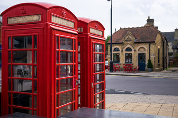 Fototapeta na wymiar Traditional red phone boxes in St Ives, Cambridgeshire, England