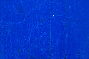 Texture background of wooden planks covered with old peeling paint