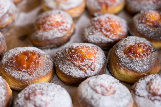 donut and powdered sugar on baking paper