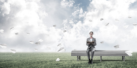 Young businessman or student studying the science and paper plan