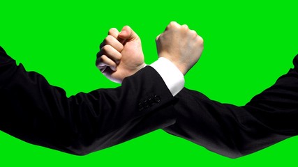 Business confrontation, fists on green screen background, market competition