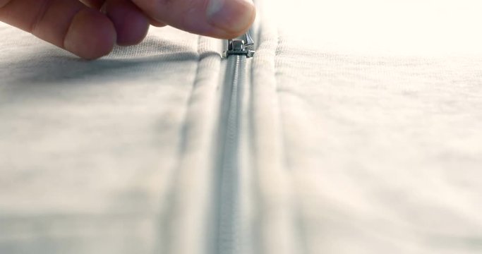 Modern close up of zipper on fashion clothes. 4K footage.