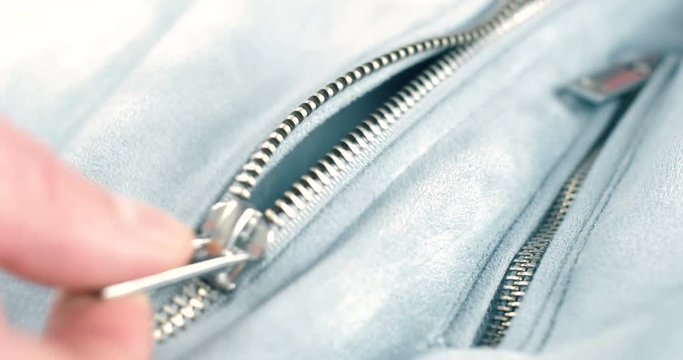 Modern close up of zipper on fashion clothes. 4K footage.