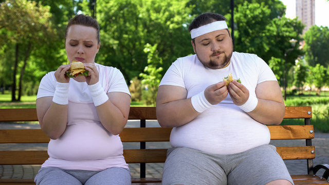 Fat Couple Eating Burgers, Feeling Guilty For Stopping Diet, Fast Food Addicted