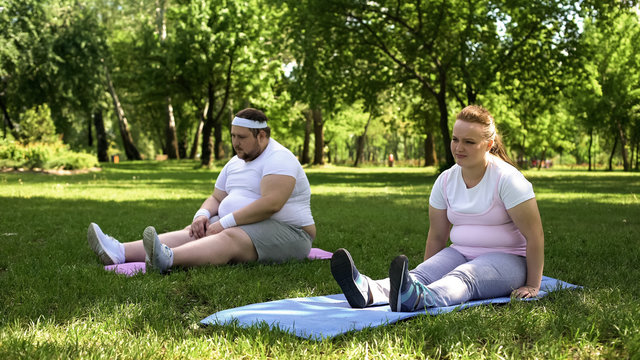 Obese Couple Resting After Hard Training, Lack Of Motivation, Weight Loss