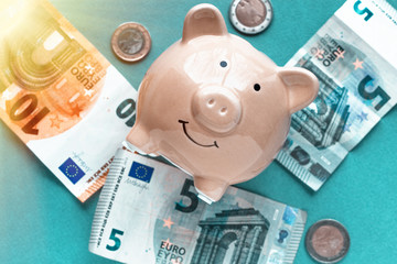 piggy bank concept isolated on blue background