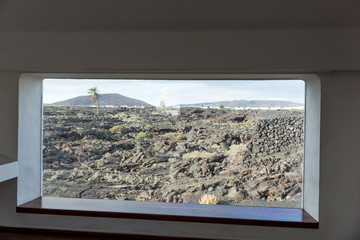 Looking through the window at the lava. Lanzarote. Canary Islands. Spain
