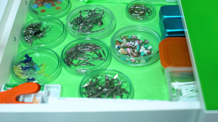 Dentistry equipment in petri cups on table, modern tools in stomatology clinic