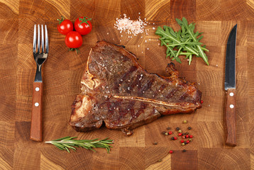 Close up porterhouse beef steak on wooden board