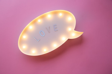 Creative Valentine Day romantic composition. flat lay love holiday celebration text love on lightbox on pink background with copy space