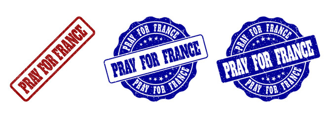 PRAY FOR FRANCE scratched stamp seals in red and blue colors. Vector PRAY FOR FRANCE labels with dirty surface. Graphic elements are rounded rectangles, rosettes, circles and text labels.