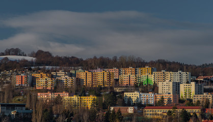 Fototapeta na wymiar Vimperk town and block of flats in cold winter evening in sunset time