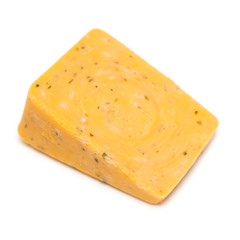 Double Gloucester cheese with onions and chives isolated on white studio background.