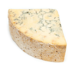 Mature blue stilton cheese isolated on a white studio background.