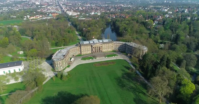 aerial shot of Bergpark Wilhelmshöhe, Kassel, Germany. UNESCO World-Heritage Site. Aerial shot  begins in front with view of city and palace.