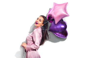Beauty fashion model party girl with heart shaped air balloons having fun. Birthday party,...