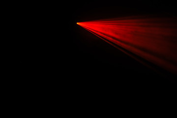 red laser beams in the dark
