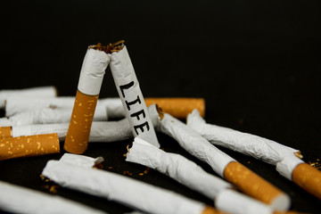 Cigarettes on a black background. Fight against smoking. stop cigarettes. Bad habit