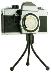 old movie camera on tripod with clock