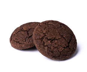 Two dark chocolate cookies on white background, isolated