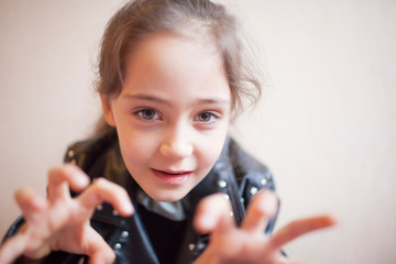 Portrait of a little girl in a rocker jacket