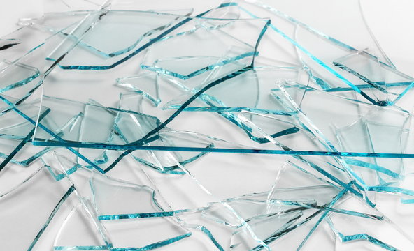 Broken glass pile pieces texture and background, isolated on white, cracked window effect