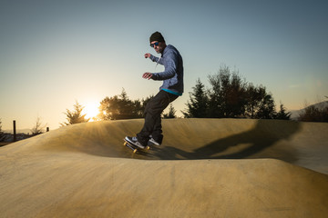 Skateboarder on a pump track park