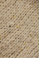 Cream knitted texture with gold sequins