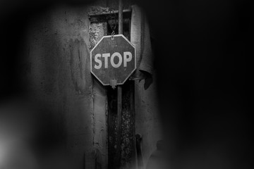 Stop sign between shadows