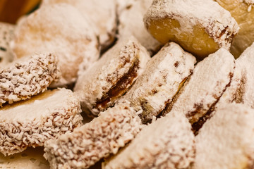 alfajores freshly baked cookies closeup on a plate on the table. horizontal