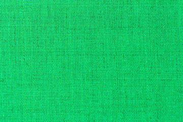 Bright UFO green color glitter background texture with defocused patches