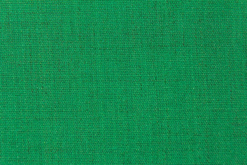 The structure is dark green fabric with a natural texture. Fabric background.