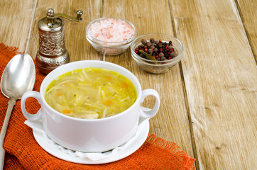 Chicken broth vermicelli on wooden table, dinne