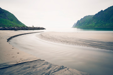 Sand beach in Senja island, Norway. Cold and cloudy day.
