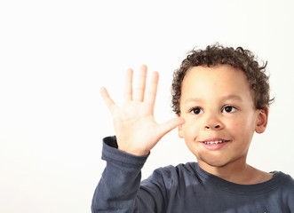 little boy showing stop gesture