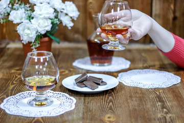 Romantic date night. Holding glasses of brandy, say a toast