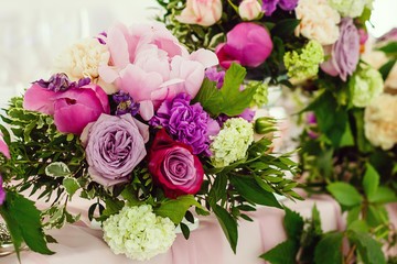Pink roses bouquet over wooden table. Top view with copy space