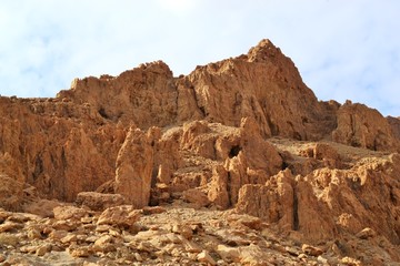 Qumran caves in Qumran National Park, where the dead sea scrolls were found, Judean desert hike, Israel