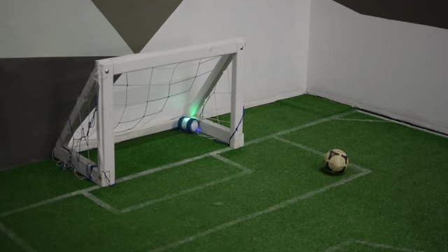 Radio-controlled toy stuck in a football goal