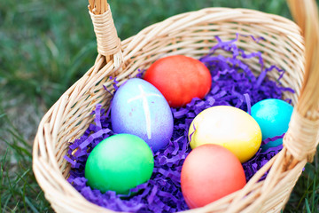 Egg with Cross among basket of colored Eggs