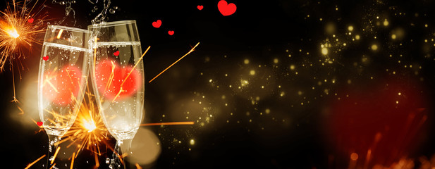 Sparkling wine with hearts in the glasses, greeting card Valentine's Day